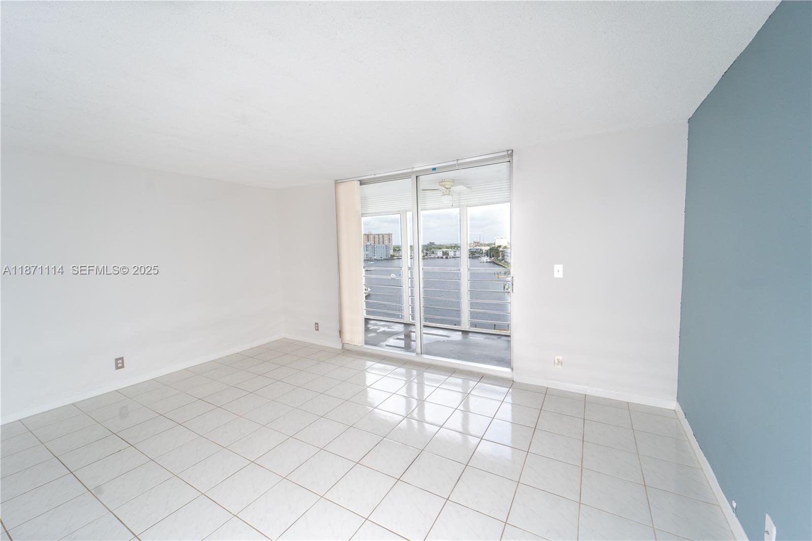 100 Golden Isles Drive, Unit 809 Hallandale Beach, FL 33009 - Photo 8 of 18 an empty room with windows