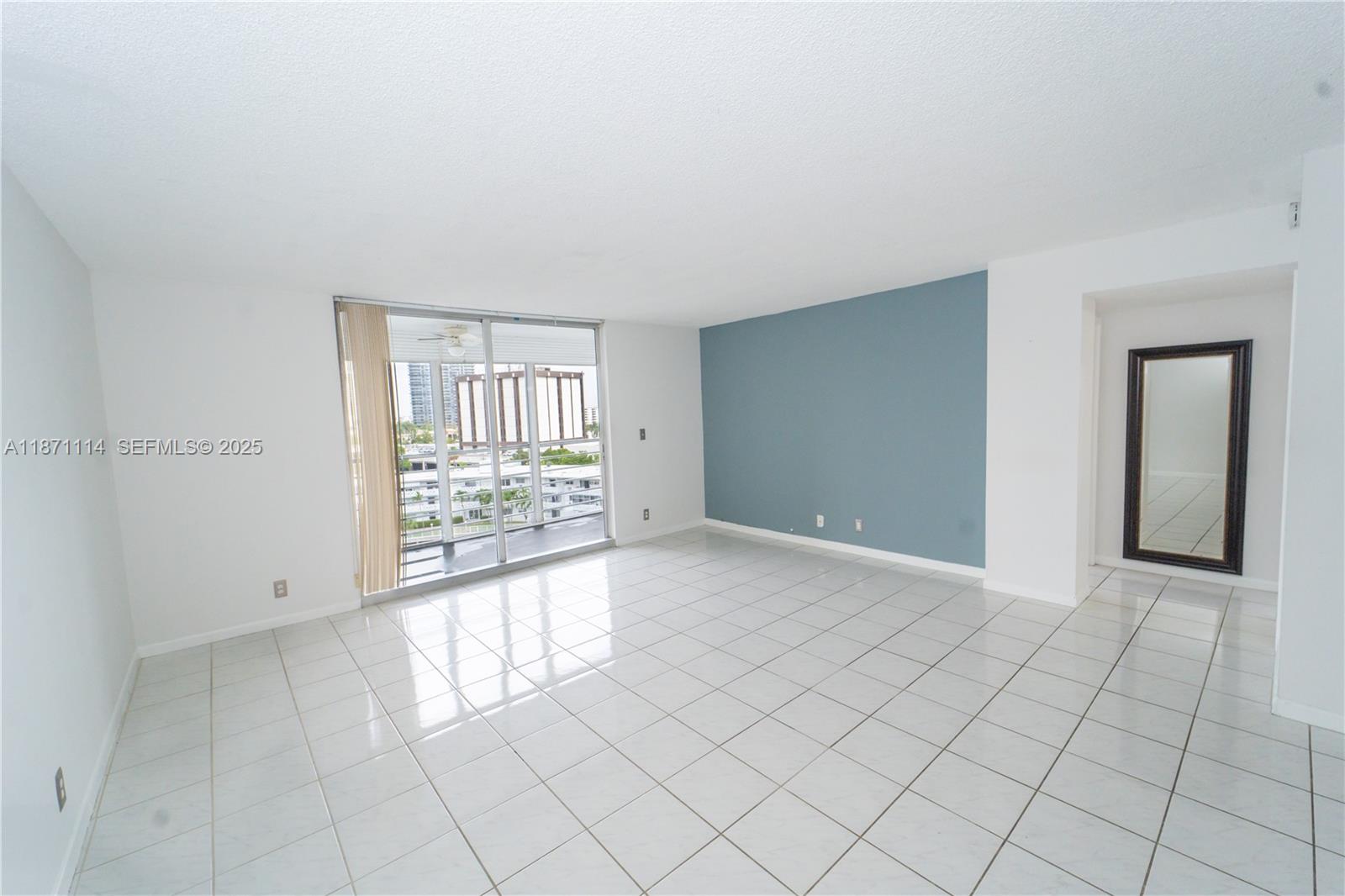 100 Golden Isles Drive, Unit 809 Hallandale Beach, FL 33009 - Photo 9 of 18 an empty room with windows