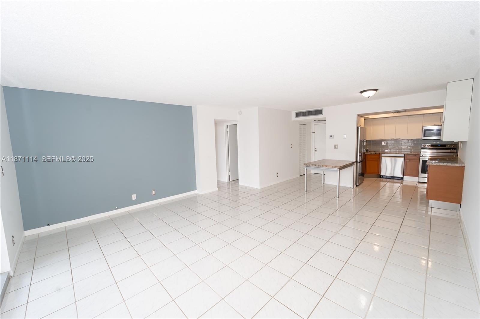 100 Golden Isles Drive, Unit 809 Hallandale Beach, FL 33009 - Photo 10 of 18 a view of a living room hardwood