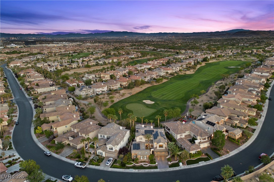 1911 Alcova Ridge Drive Las Vegas, NV 89135 - Photo 43 of 43 Aerial view at dusk featuring view of golf course, a mountain view, and a residential view