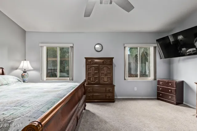 a living room with fireplace furniture and a window