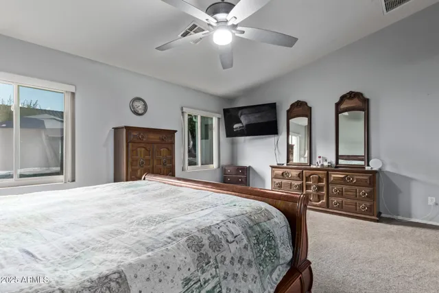 a bedroom with bed and window