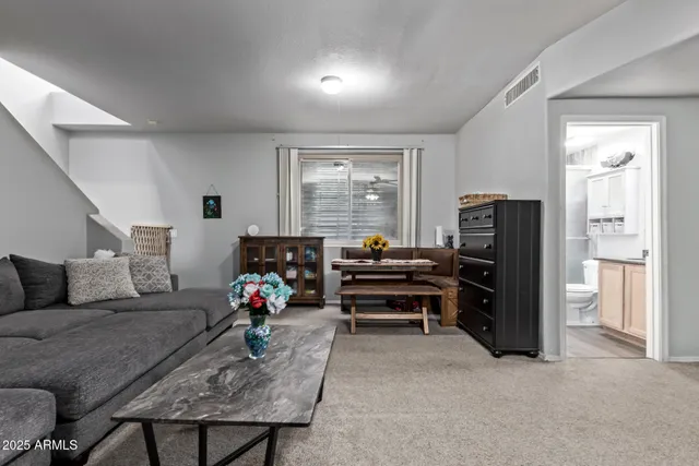 a view of a chairs and table in the patio
