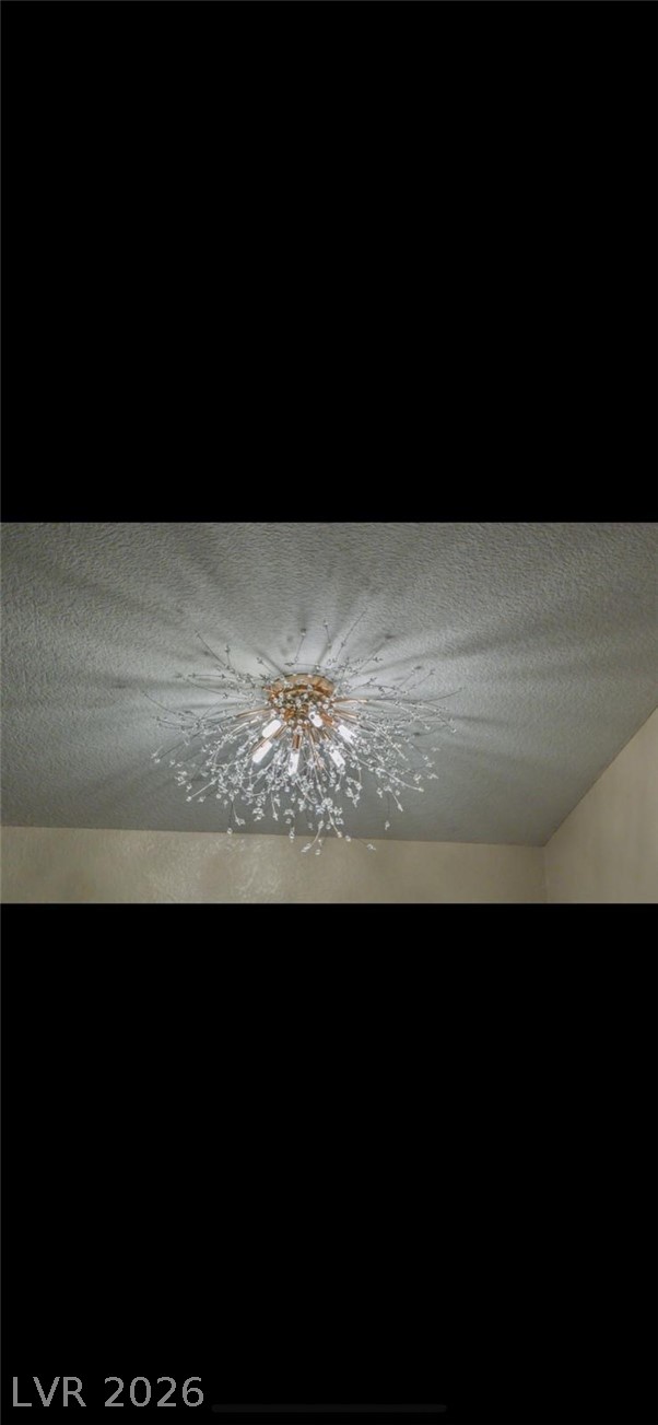 5131 South Lindell Road, Unit 205 Las Vegas, NV 89118 - Photo 5 of 22 Room details featuring a textured ceiling