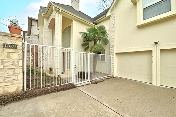 3203 Tom Green Street, Unit 3A Austin, TX 78705 - Photo 1 of 33 a view of a house with a wooden fence