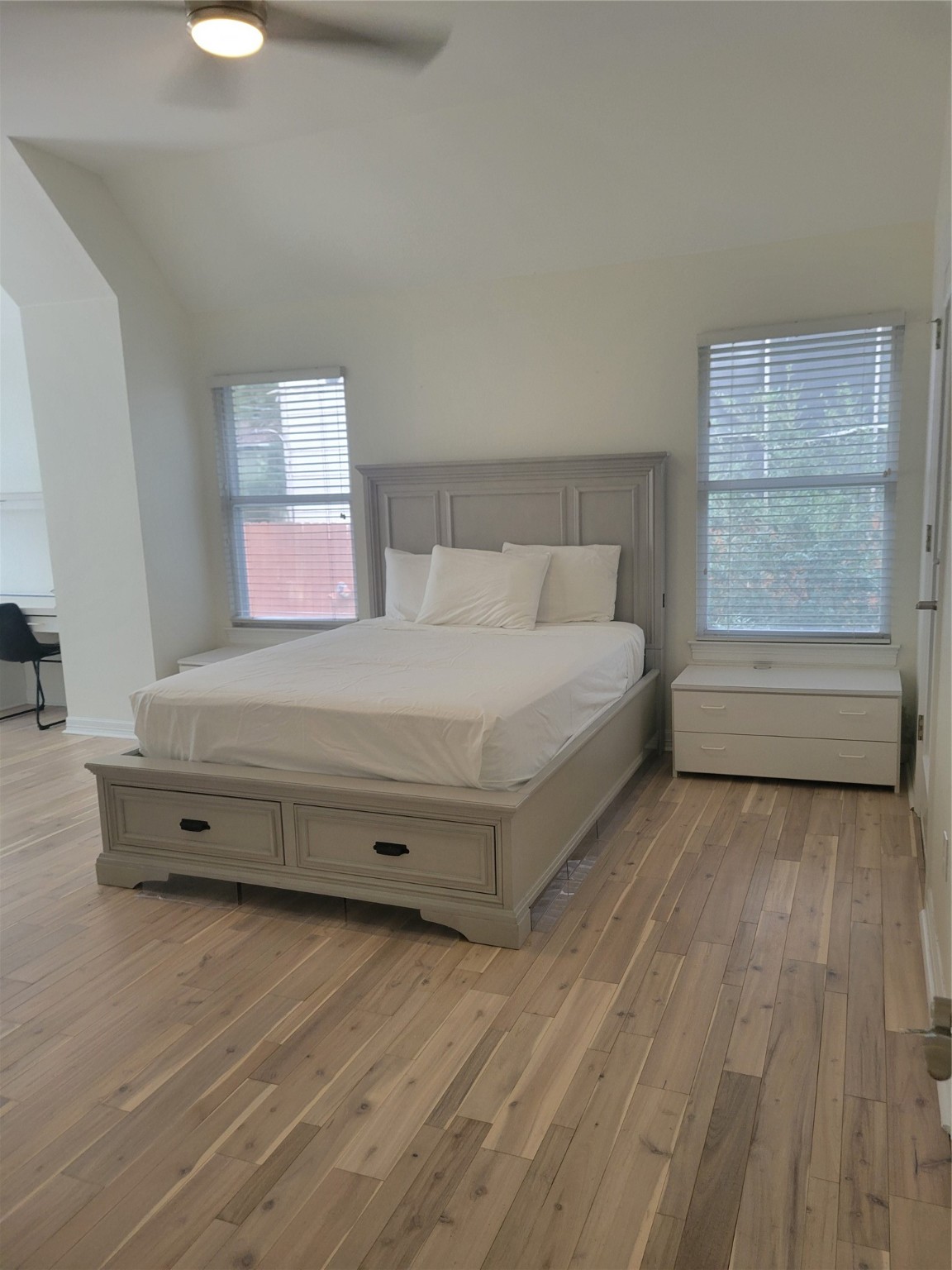 3203 Tom Green Street, Unit 3A Austin, TX 78705 - Photo 16 of 33 a spacious bedroom with a bed and a window