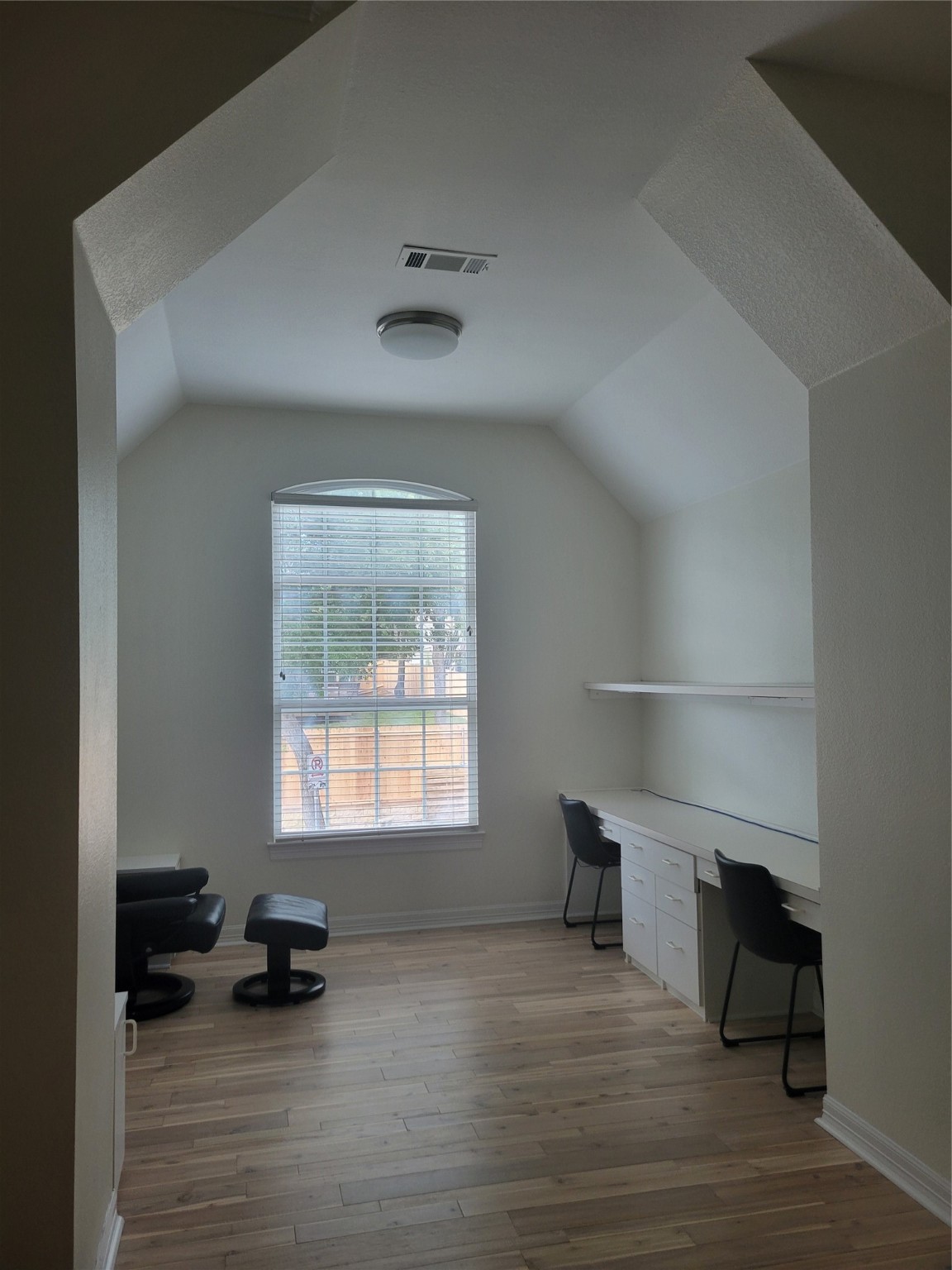 3203 Tom Green Street, Unit 3A Austin, TX 78705 - Photo 18 of 33 a view of a room wooden floor and windows