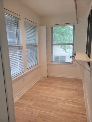 a view of an empty room with a window