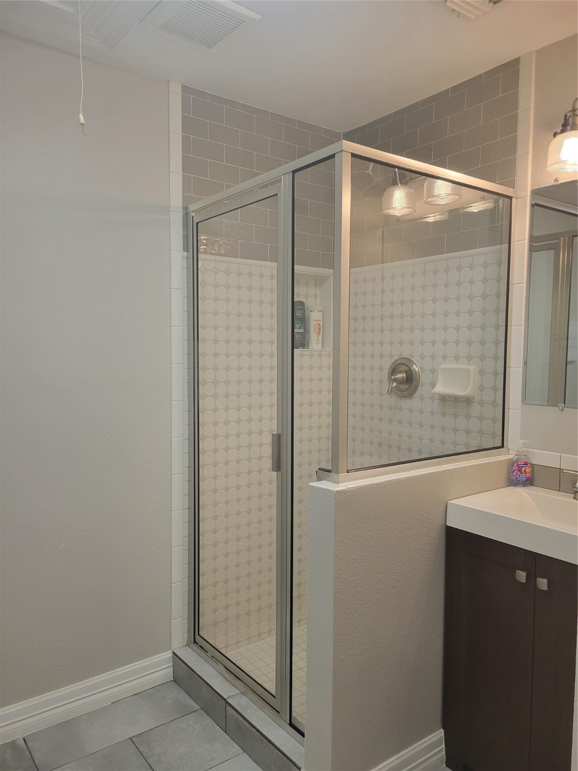 3203 Tom Green Street, Unit 3A Austin, TX 78705 - Photo 32 of 33 a bathroom with a shower and a sink