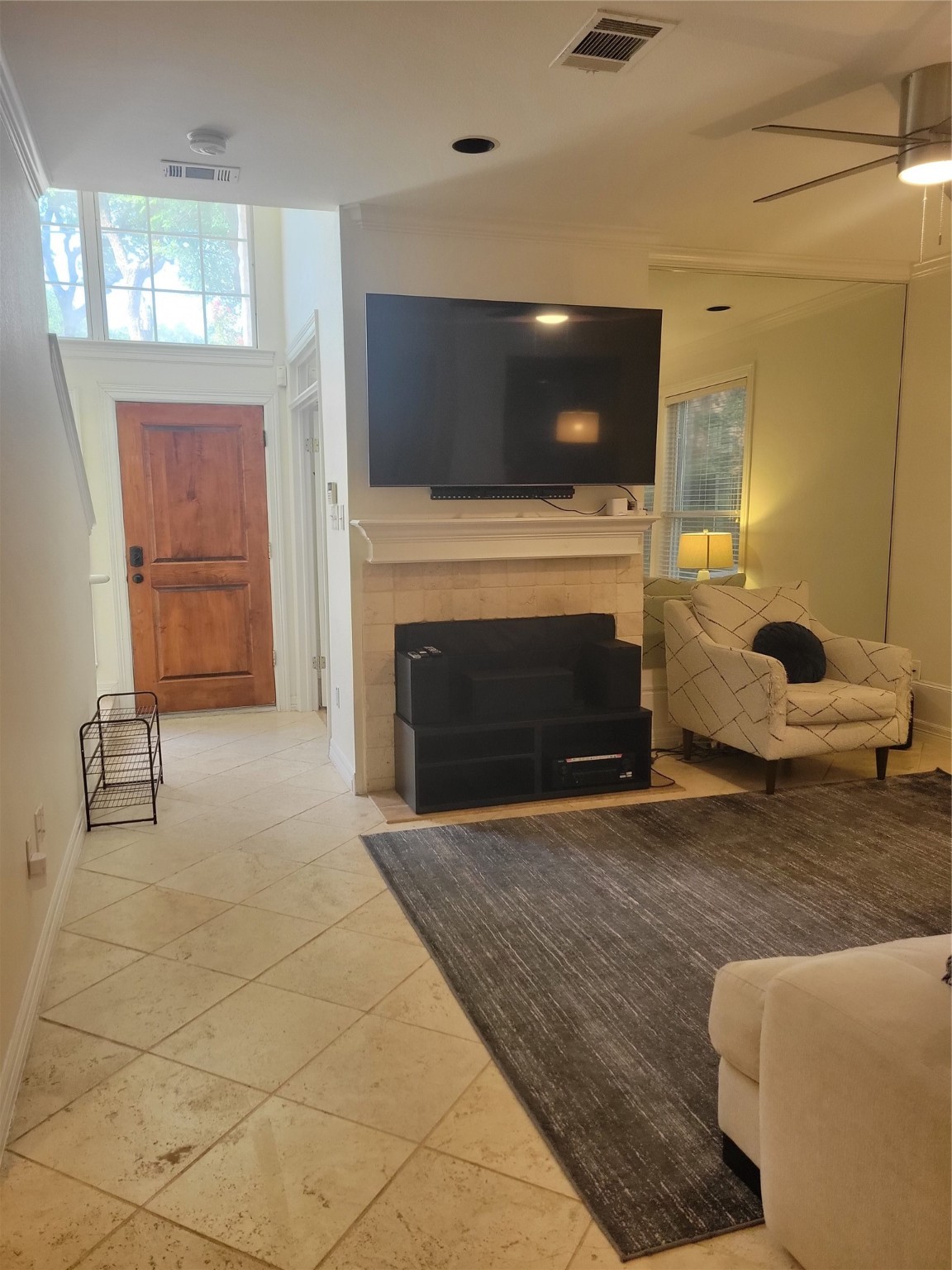 3203 Tom Green Street, Unit 3A Austin, TX 78705 - Photo 7 of 33 a living room with furniture a flat screen tv and a fireplace