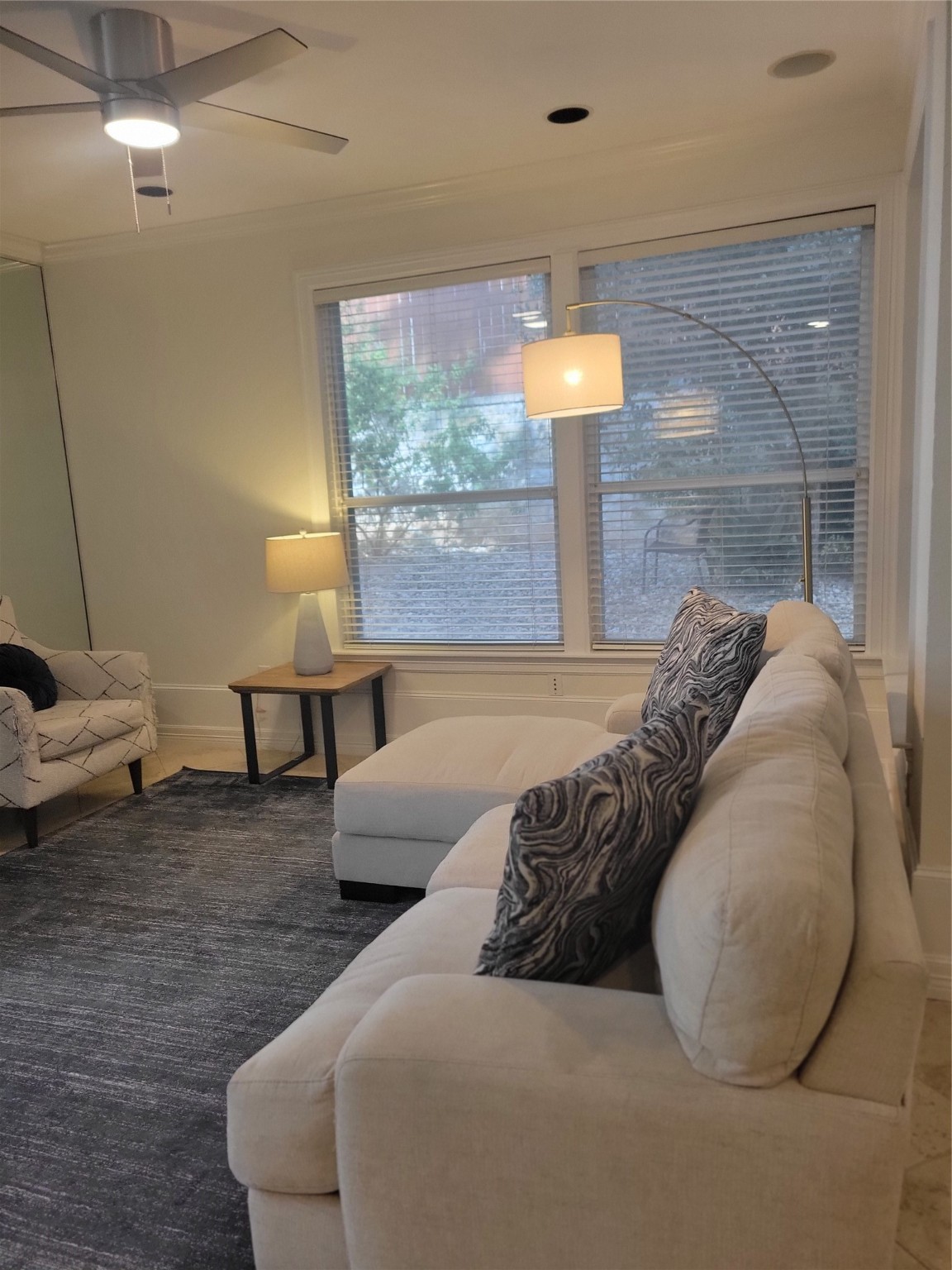 3203 Tom Green Street, Unit 3A Austin, TX 78705 - Photo 9 of 33 a bed sitting in a bedroom next to a lamp