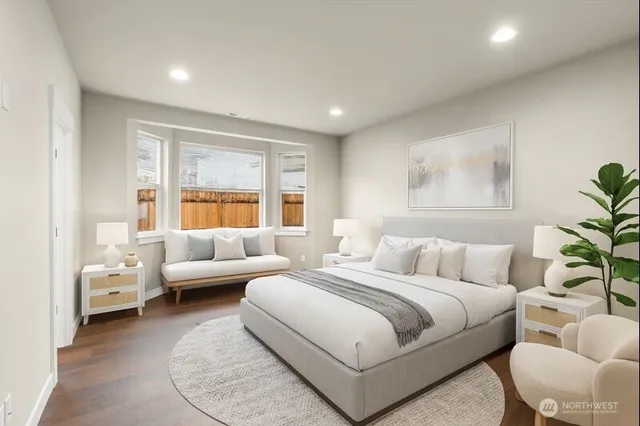 a bedroom with a bed and a couch