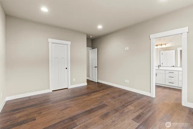 wooden floor in an empty room with wooden floor and windows