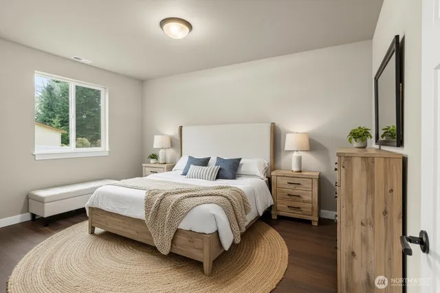 a bedroom with bed and a window