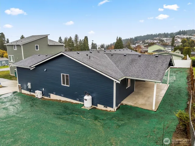 an aerial view of residential houses with outdoor space