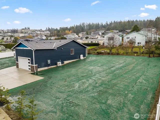 a view of a pathway with a wrought fence
