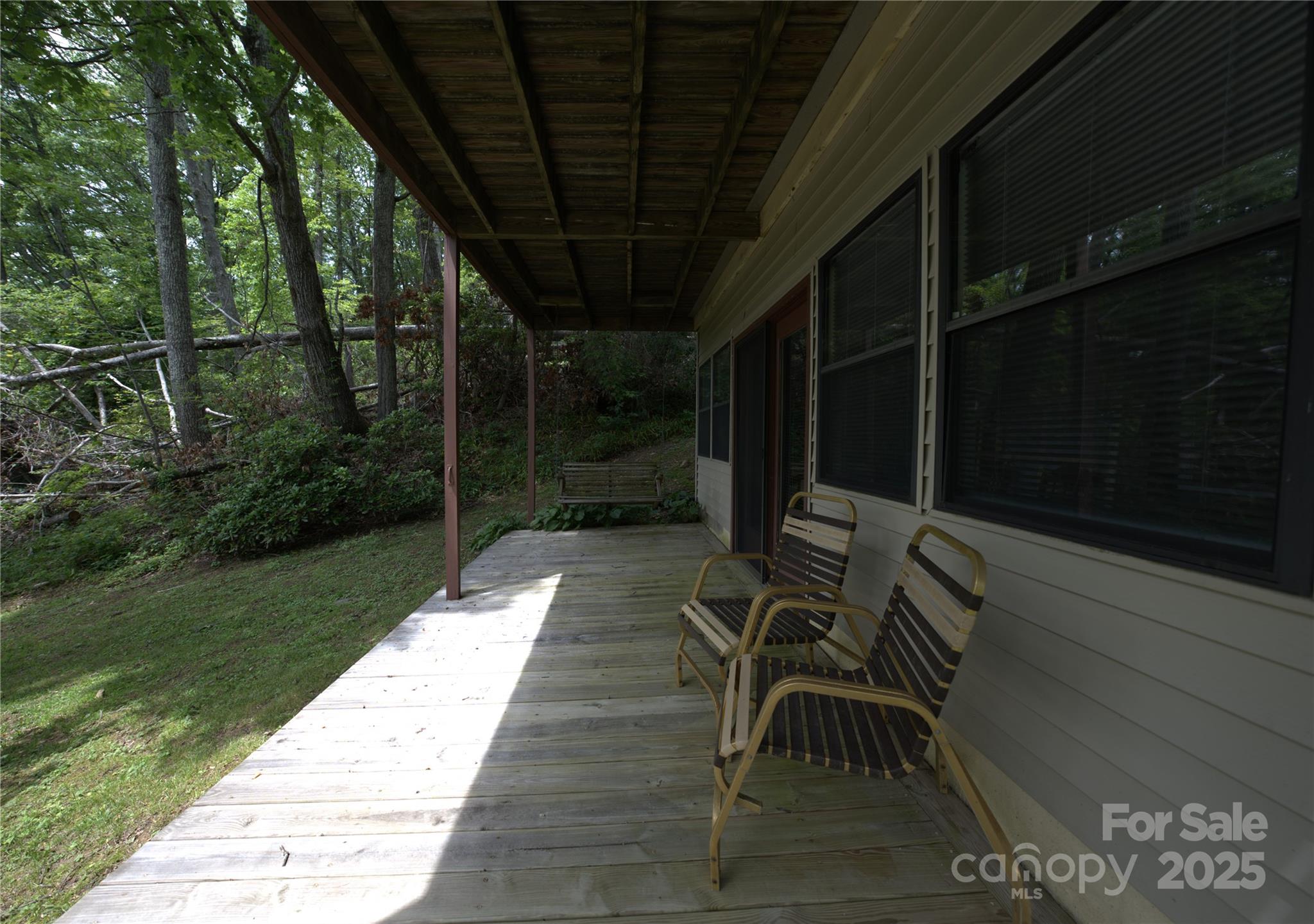 218 McGuffey Ridge Road Gerton, NC 28735 - Photo 12 of 29 a patio with table and chairs