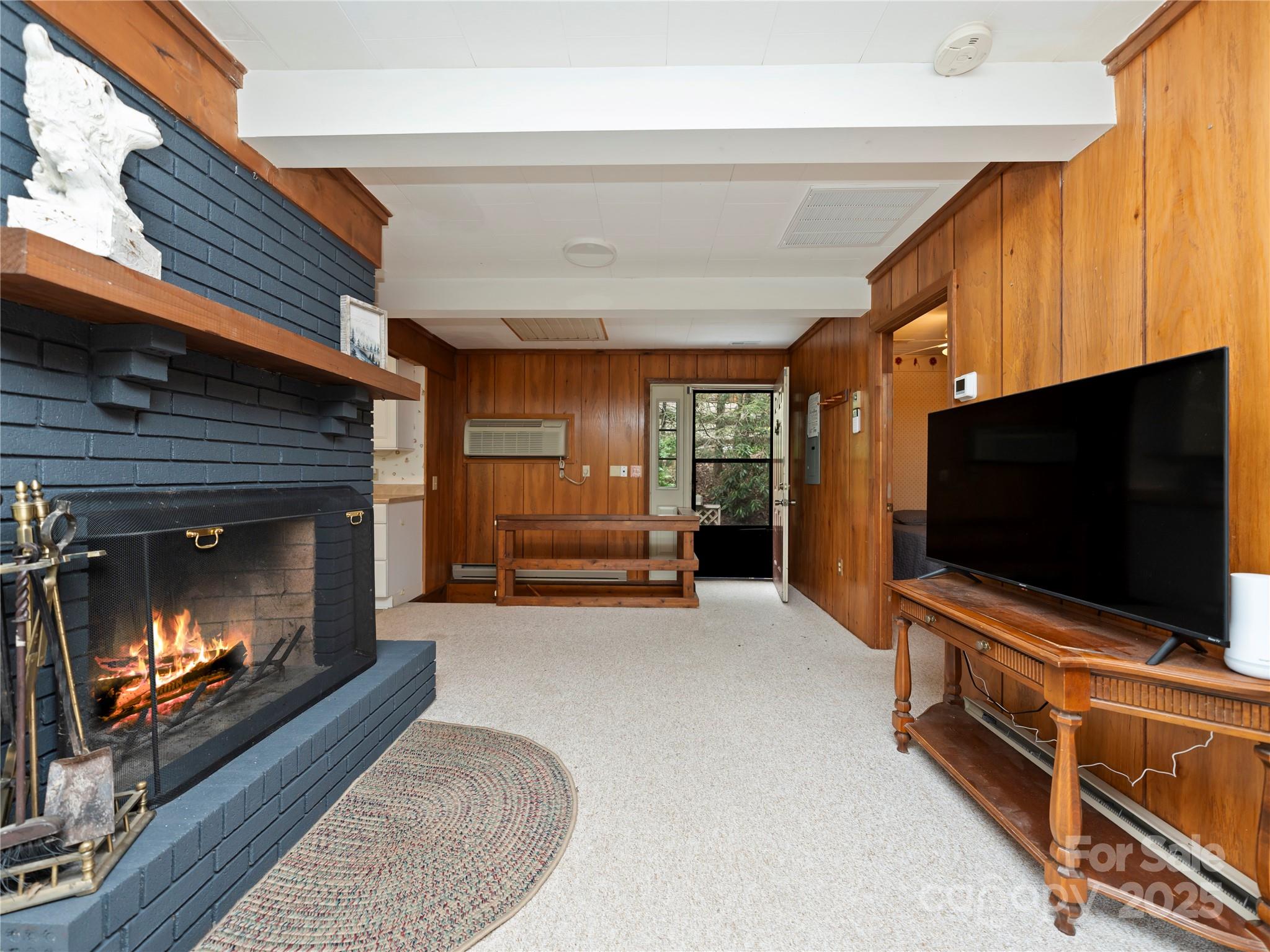 218 McGuffey Ridge Road Gerton, NC 28735 - Photo 15 of 29 a living room with furniture and a flat screen tv