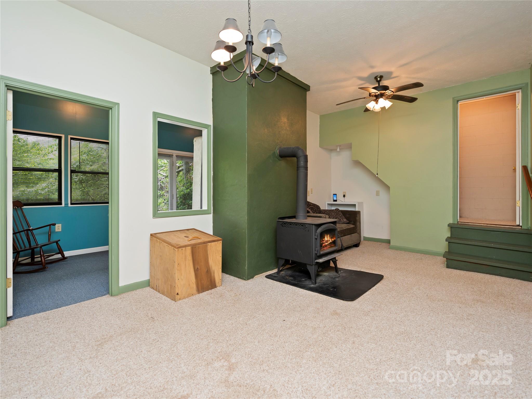 218 McGuffey Ridge Road Gerton, NC 28735 - Photo 23 of 29 a bedroom with a bed dresser and a window