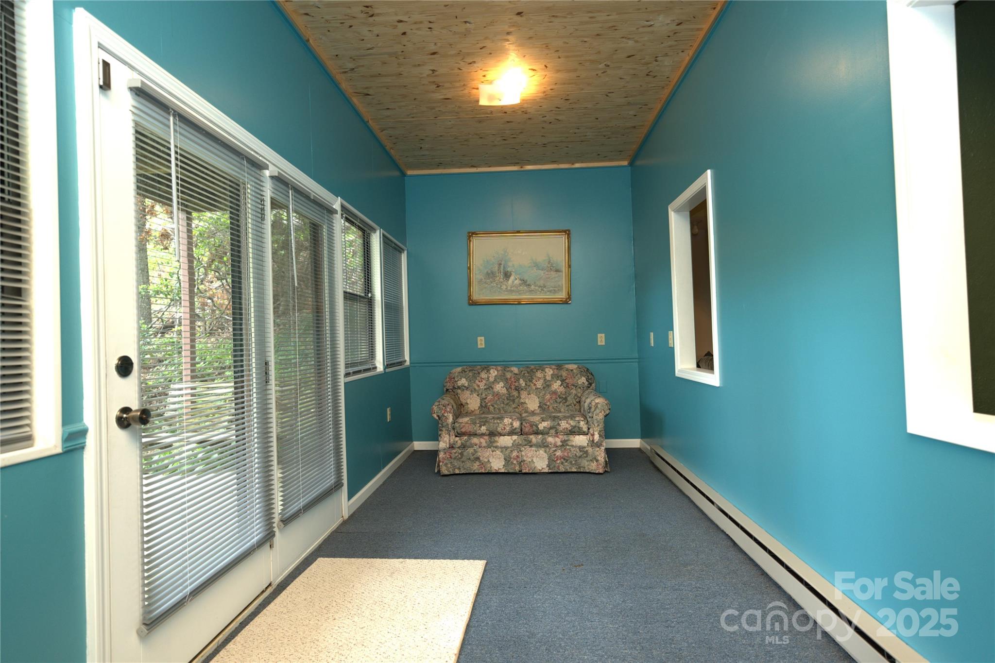 218 McGuffey Ridge Road Gerton, NC 28735 - Photo 24 of 29 a room with window and furniture