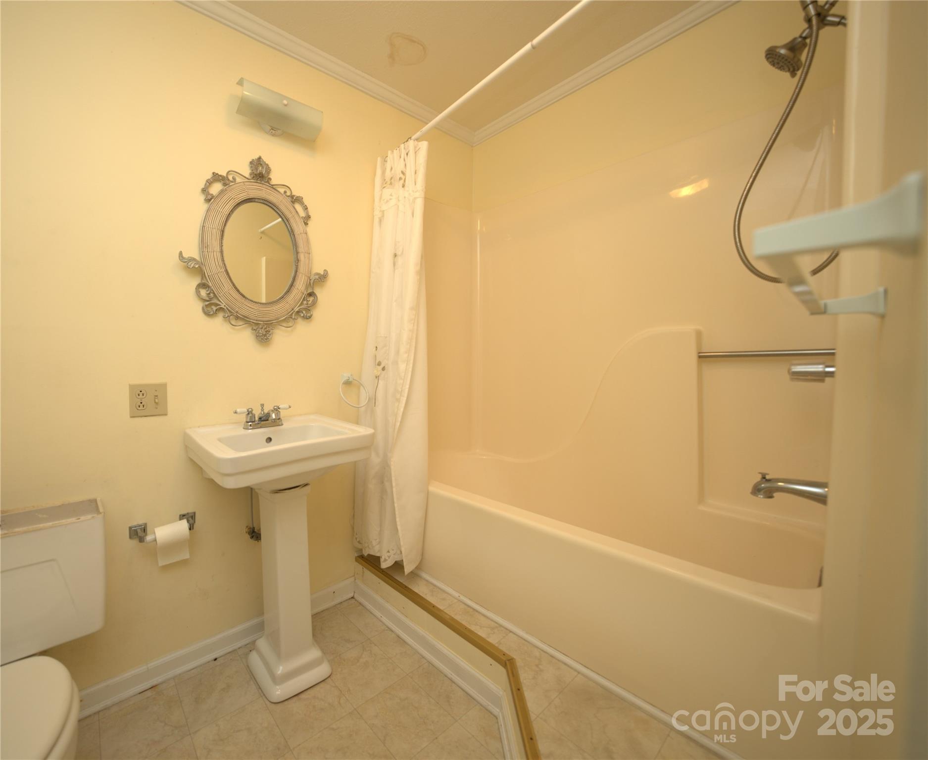 218 McGuffey Ridge Road Gerton, NC 28735 - Photo 27 of 29 a bathroom with a sink a toilet and shower