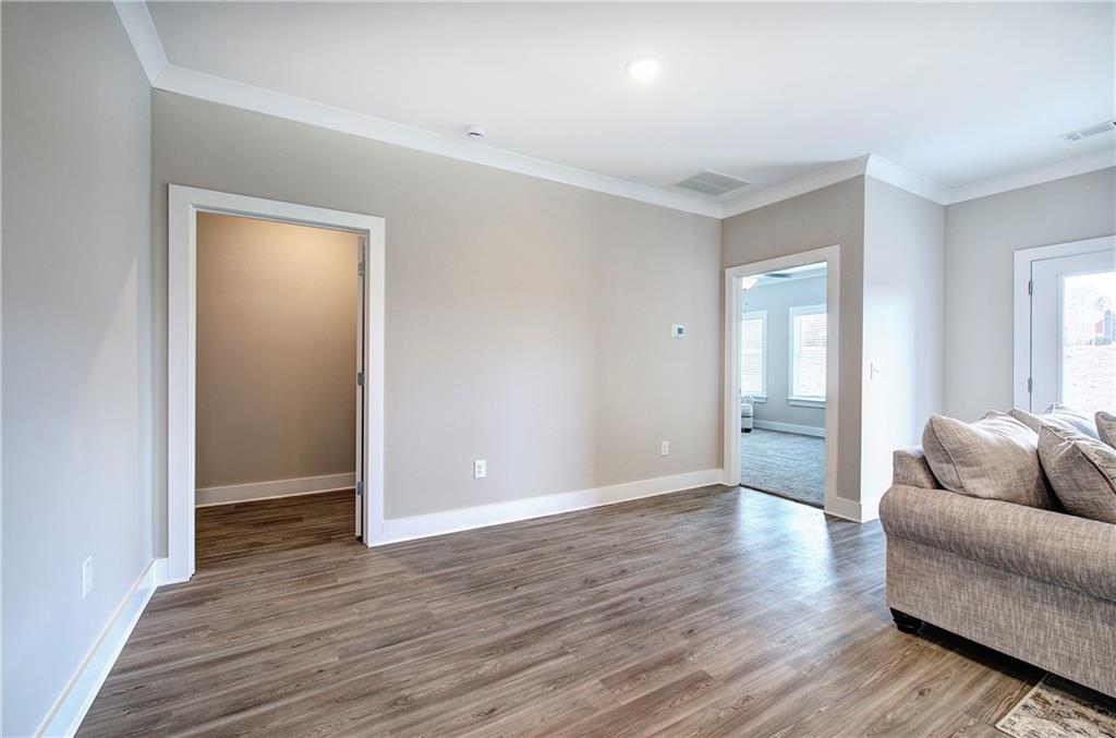 146 Sunflower Circle Cartersville, GA 30121 - Photo 13 of 44 a view of livingroom with hardwood floor and window
