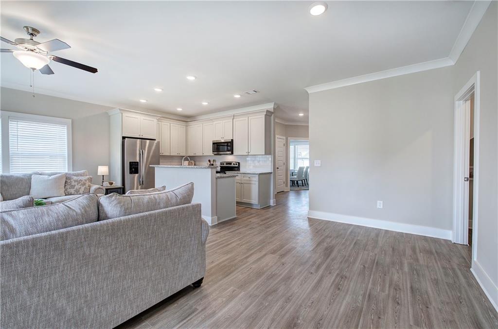146 Sunflower Circle Cartersville, GA 30121 - Photo 15 of 44 a living room with furniture and a wooden floor