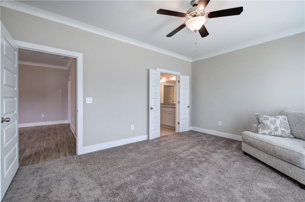 146 Sunflower Circle Cartersville, GA 30121 - Photo 19 of 44 a living room with furniture and a ceiling fan