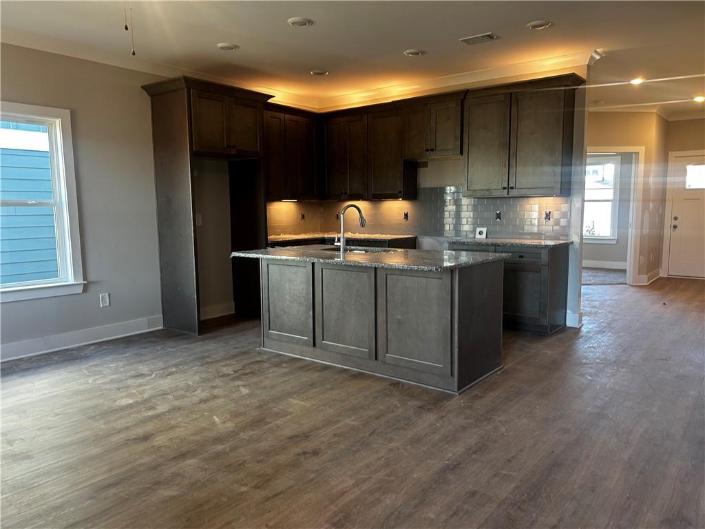 146 Sunflower Circle Cartersville, GA 30121 - Photo 2 of 44 a kitchen with stainless steel appliances granite countertop a sink and a stove