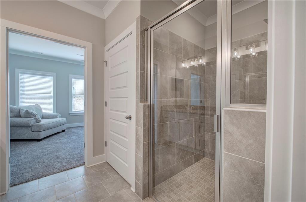 146 Sunflower Circle Cartersville, GA 30121 - Photo 25 of 44 a bathroom with a glass shower door and a glass door shower