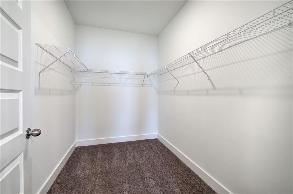 146 Sunflower Circle Cartersville, GA 30121 - Photo 26 of 44 a view of a room with racks on the wall