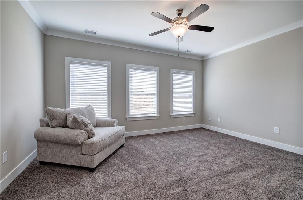 146 Sunflower Circle Cartersville, GA 30121 - Photo 27 of 44 a living room with furniture and a large window