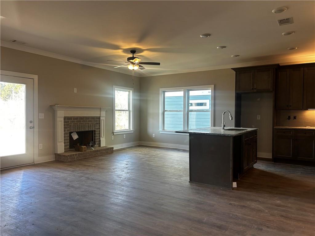 146 Sunflower Circle Cartersville, GA 30121 - Photo 3 of 44 a view of an empty room with a fireplace and a window
