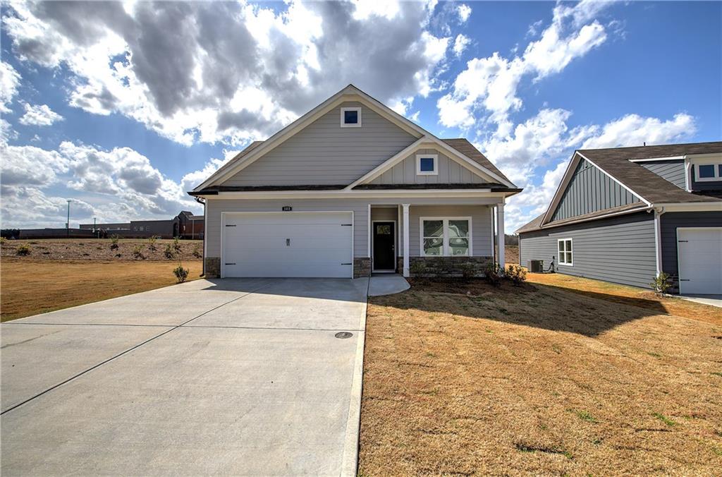 146 Sunflower Circle Cartersville, GA 30121 - Photo 35 of 44 a front view of a house with a yard and garage