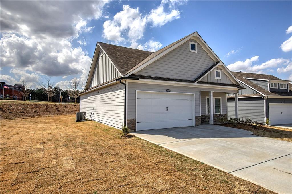146 Sunflower Circle Cartersville, GA 30121 - Photo 36 of 44 a front view of a house with a yard and garage