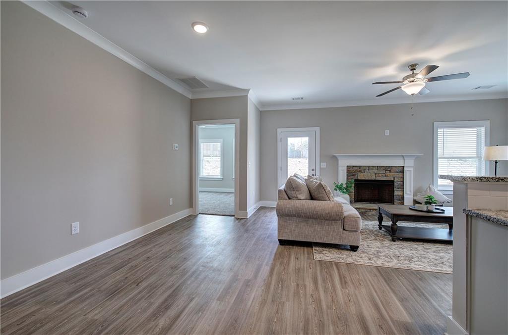 146 Sunflower Circle Cartersville, GA 30121 - Photo 7 of 44 a living room with furniture and a fireplace
