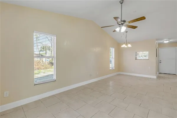 a kitchen with stainless steel appliances granite countertop a refrigerator a stove and a sink with wooden floor