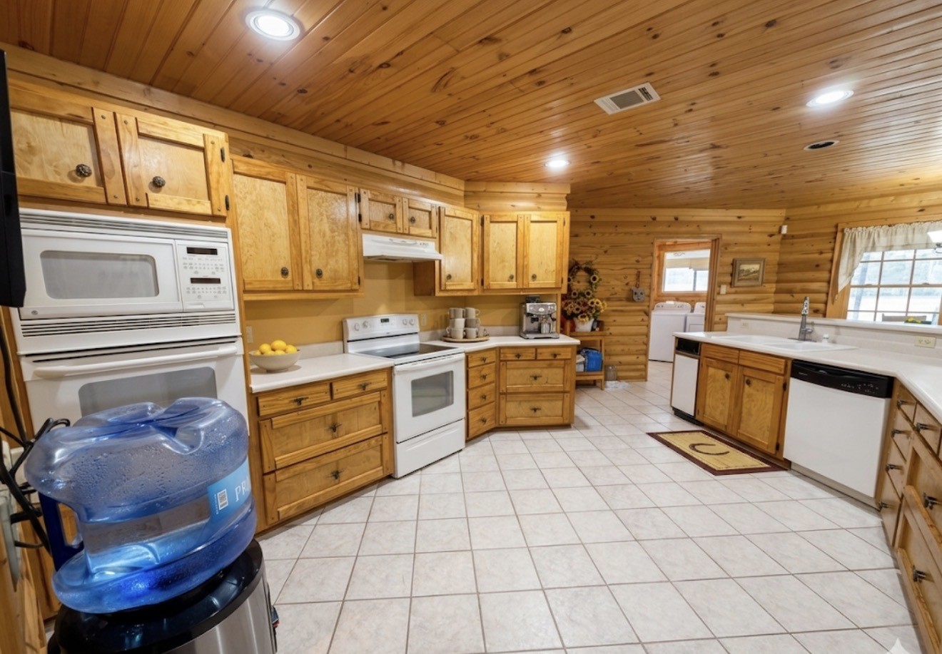 33315 Fulshear Farms Road Fulshear, TX 77441 - Photo 14 of 19 a kitchen with sink cabinets and window