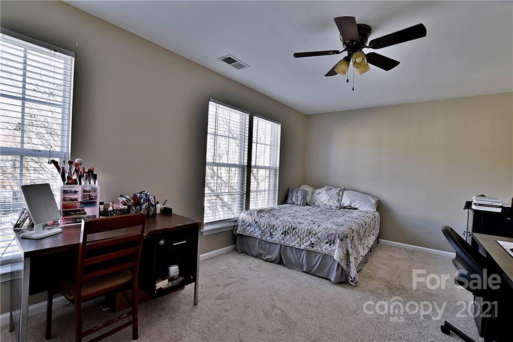 828 Dillard Road Rock Hill, SC 29730 - Photo 14 of 16 a bedroom with a bed and a window