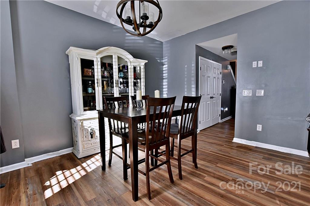 828 Dillard Road Rock Hill, SC 29730 - Photo 5 of 16 a view of a dining room with furniture wooden floor and chandelier