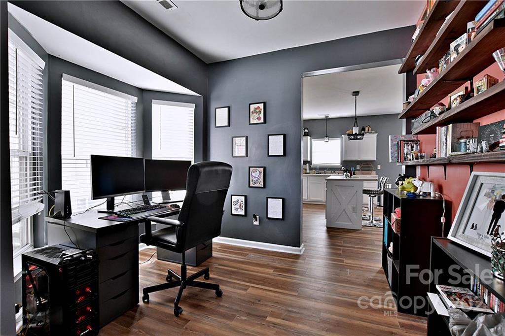 828 Dillard Road Rock Hill, SC 29730 - Photo 6 of 16 a workspace with furniture and wooden floor