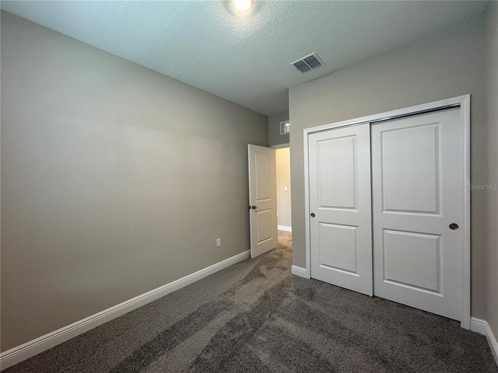 16434 Hamlin Hills Road Winter Garden, FL 34787 - Photo 35 of 50 an empty room with closet area