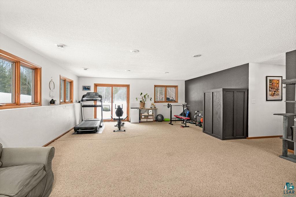 2783 Lauren Road Duluth, MN 55804 - Photo 10 of 47 Workout room with carpet and a textured ceiling