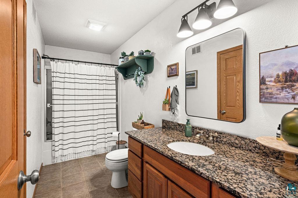 2783 Lauren Road Duluth, MN 55804 - Photo 13 of 47 Full bath featuring vanity and toilet