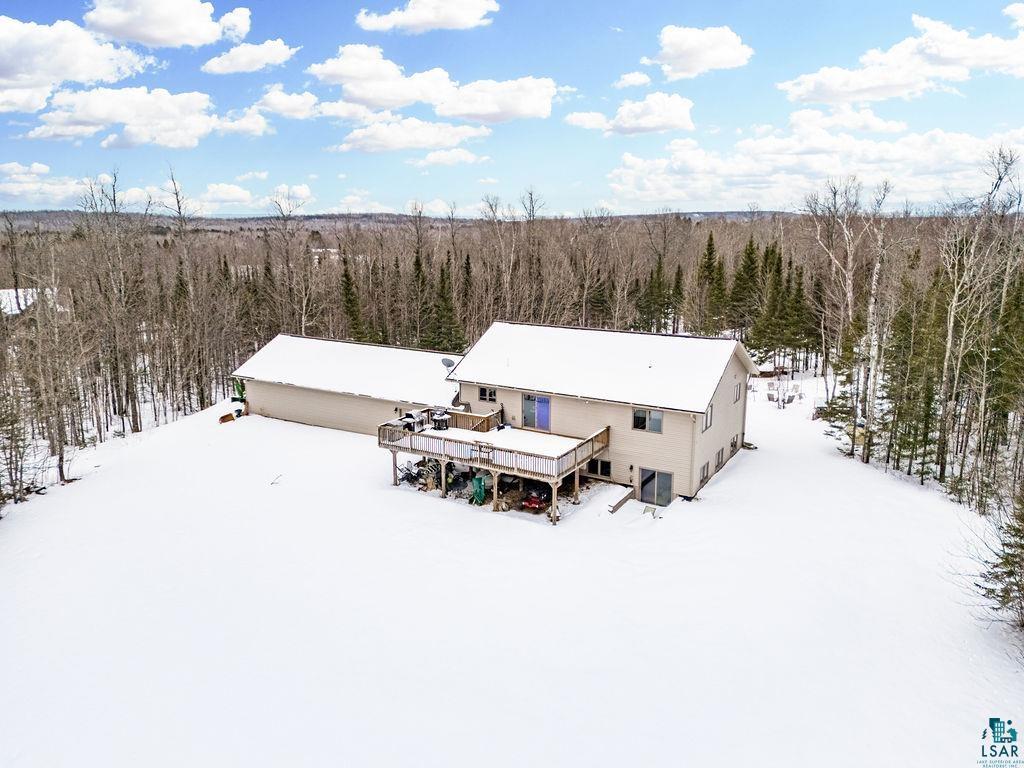 2783 Lauren Road Duluth, MN 55804 - Photo 20 of 47 Snowy aerial view featuring a forest view