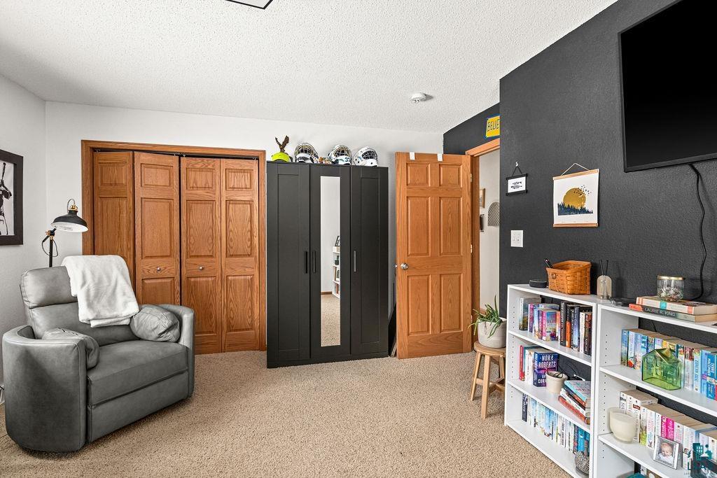 2783 Lauren Road Duluth, MN 55804 - Photo 22 of 47 Living area with light colored carpet and a textured ceiling