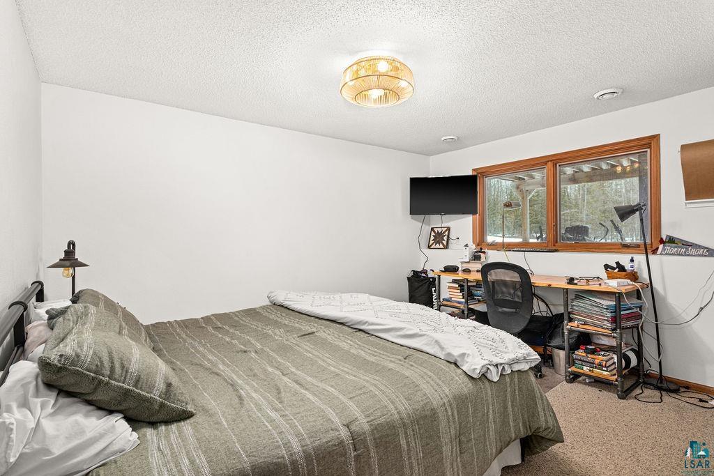 2783 Lauren Road Duluth, MN 55804 - Photo 40 of 47 Carpeted bedroom with a textured ceiling and a desk