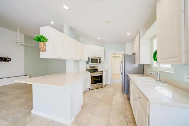 a kitchen with stove cabinets and counter space