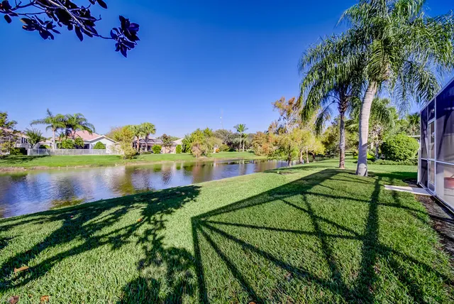 a view of a lake with a house in the background