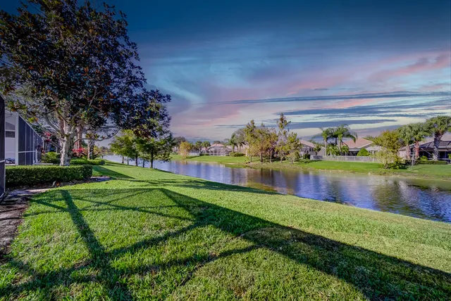 a view of a lake with a house in the background